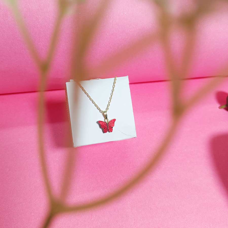 Red-colored butterfly to sit on your neck and add to your statement
